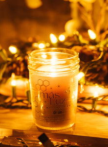 8 oz beeswax jar candle with warm lights in the background