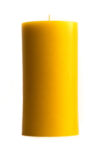 3" by 6" beeswax pillar candle on a white background